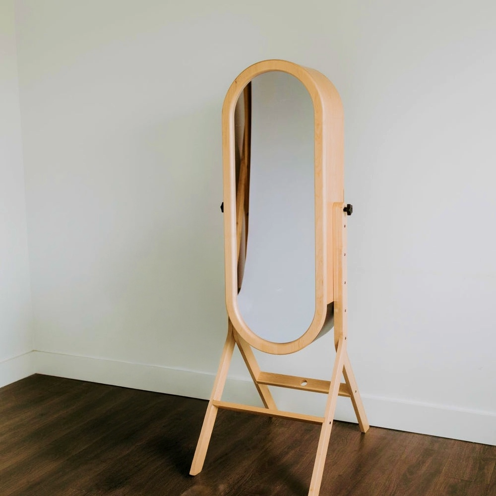 The Looking Glass — a full-length interactive mirror booth in a warm wooden frame